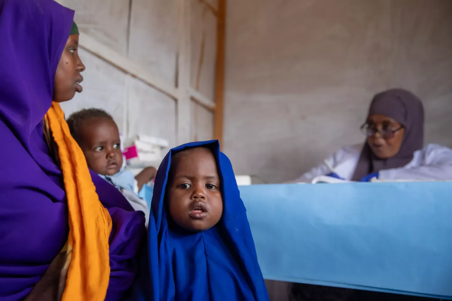 Basra and her two children get a check-up at Iftin Health Centre.