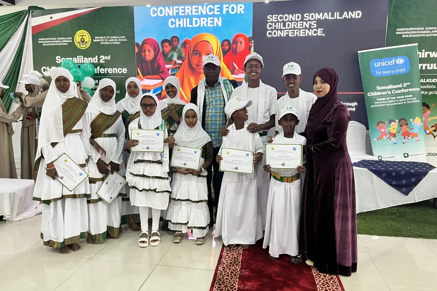 Children receive recognition certificates during the Second Somaliland Children's Conference in Hargeisa, highlighting the importance of meaningful child participation in shaping policies and decisions that affect their lives.