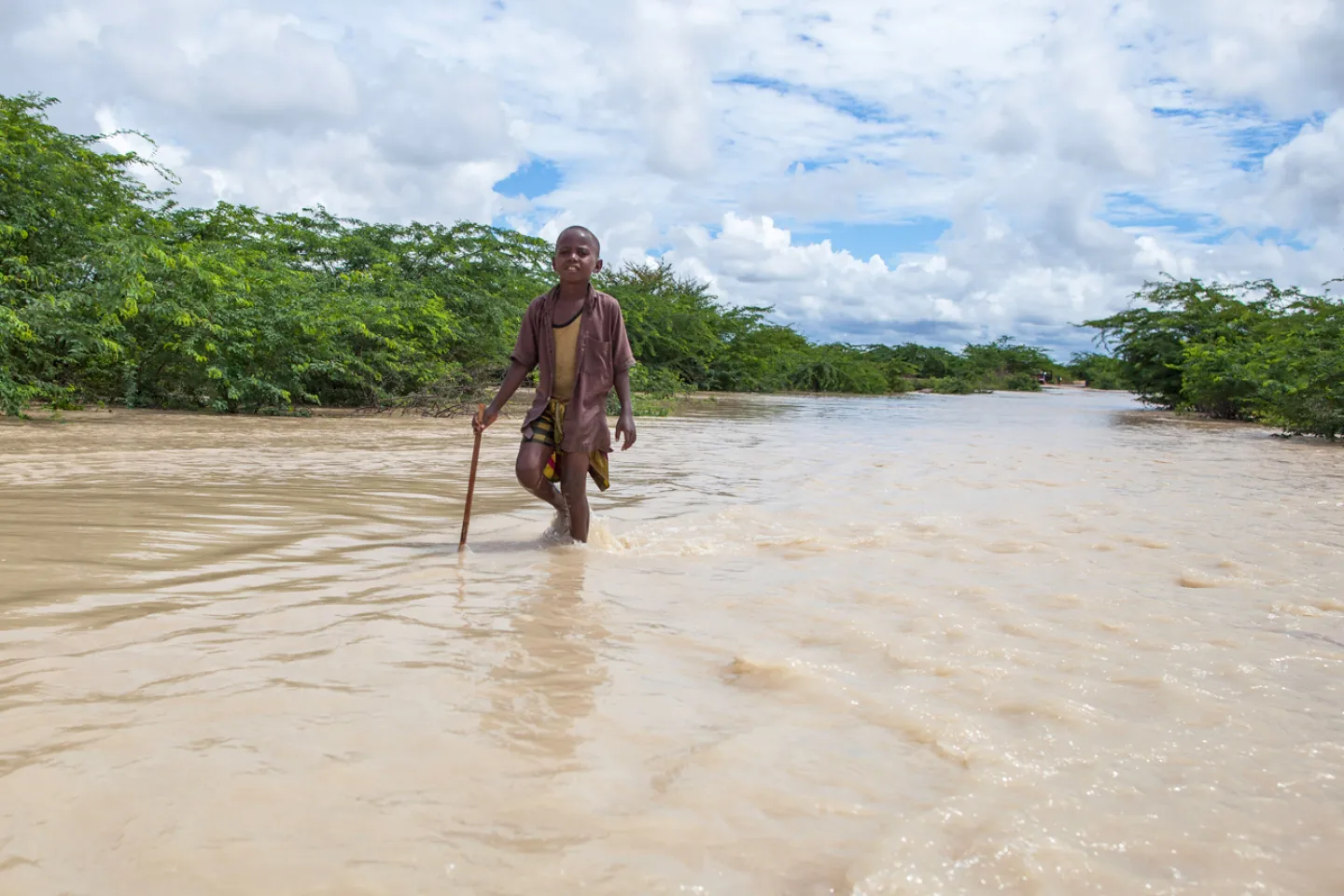 boy-walking-in-flood-water