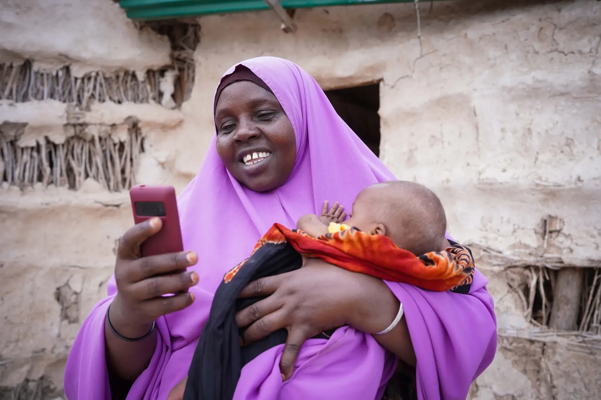 Falhado holding her phone