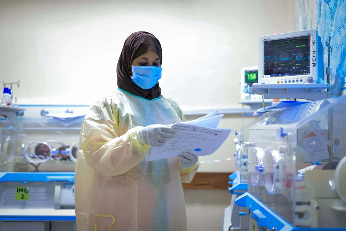 Healthcare worker Saliha Abdiasis, 31, reviews patient records in the neonatal intensive care unit at Banadir Hospital, where vulnerable newborns like Falastiin&rsquo;s baby receive lifesaving care.