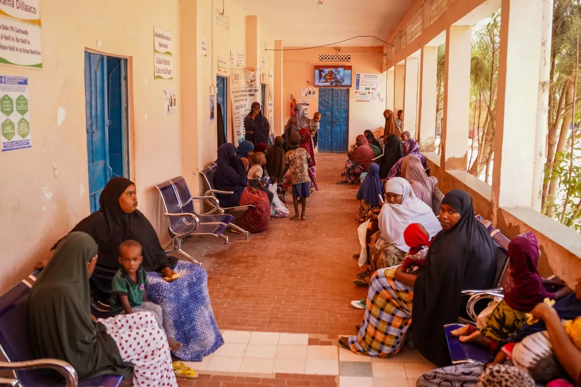 Mothers and children wait for health services at Xalanley Health Centre, where families can access essential care closer to their community.