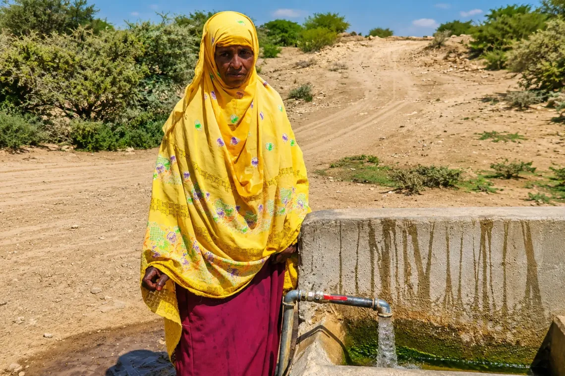 Hibak Yusuf fetches water from a water point near her home in Borama. Improved access to reliable water has reduced the long journeys families once made in search of water.
