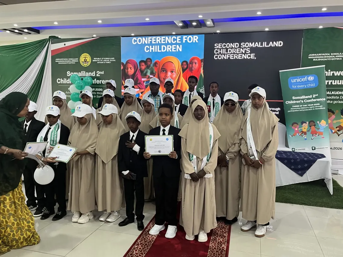 Children receive recognition certificates during the Second Somaliland Children's Conference in Hargeisa, highlighting the importance of meaningful child participation in shaping policies and decisions that affect their lives.