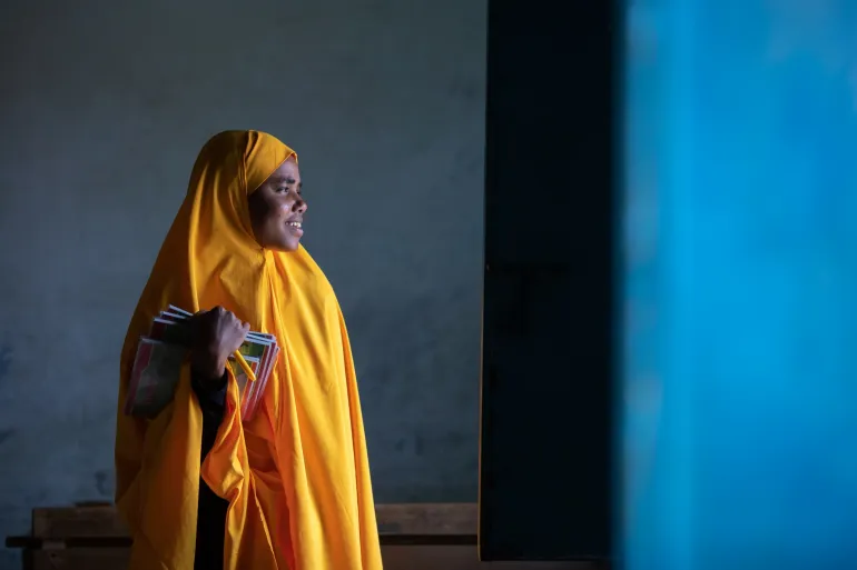 Faiza enters her classroom at Haji Aden Primary. 