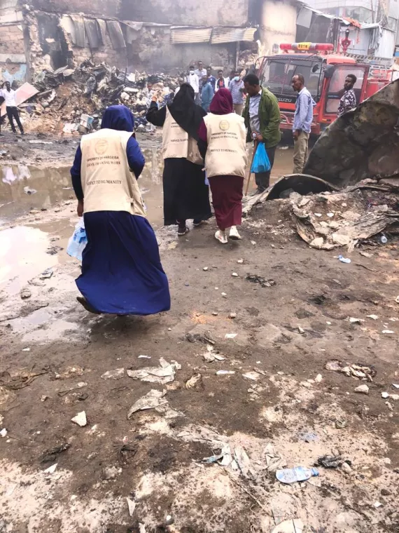 Emergency responders, offering support to traders who lost their businesses in a fire in Hargeisa.