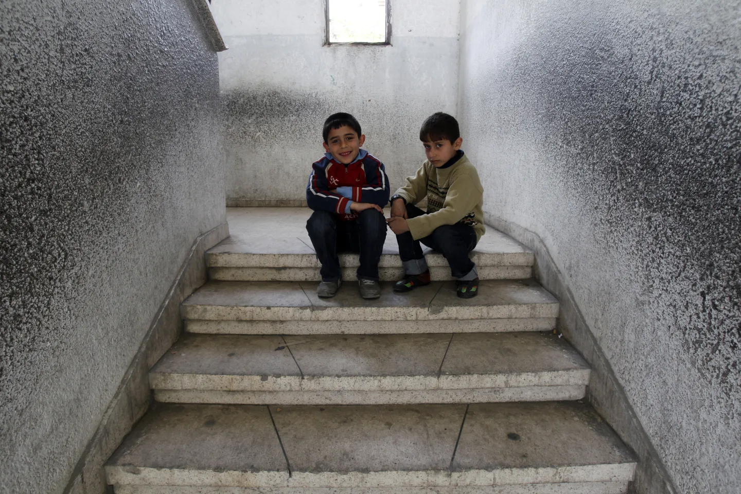 Two boys sitting
