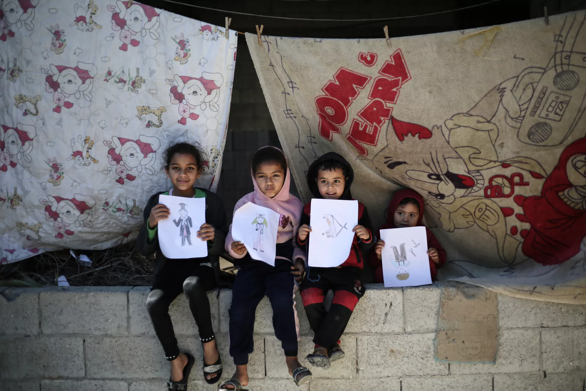 Dalia and her siblings showing the art which they did house-to-house activity.