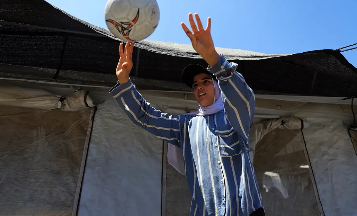 Girl plays with a ball