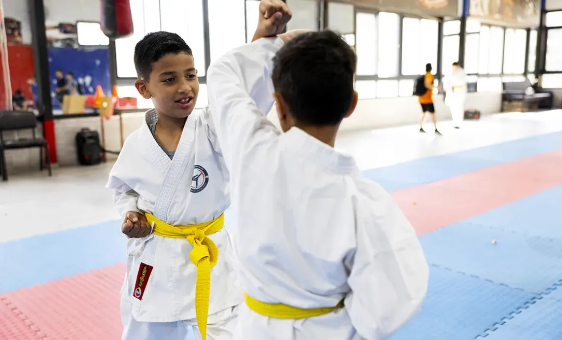 Laith, 8, learns to channel his energy through martial arts. 