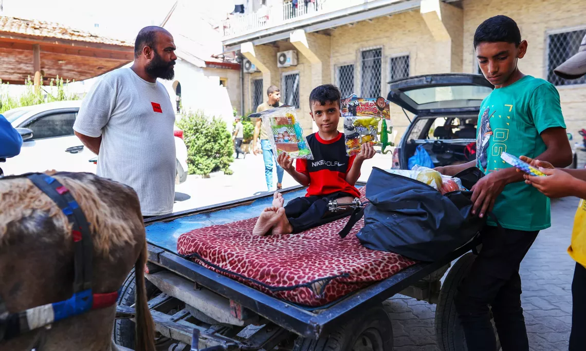Mohammad, 10, holds up figurines provided by UNICEF to vulnerable children in the northern Gaza Strip.