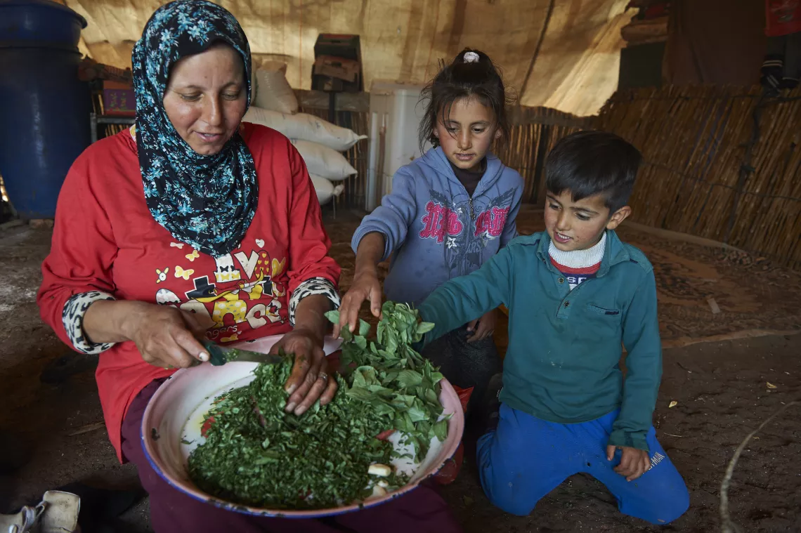 Mother making food for her children