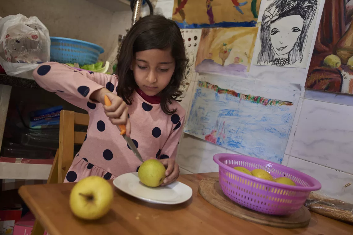 Amal Eating an Apple