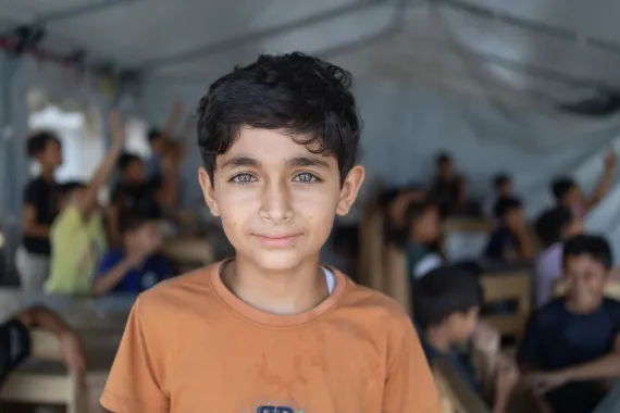 Child looks at the Camera