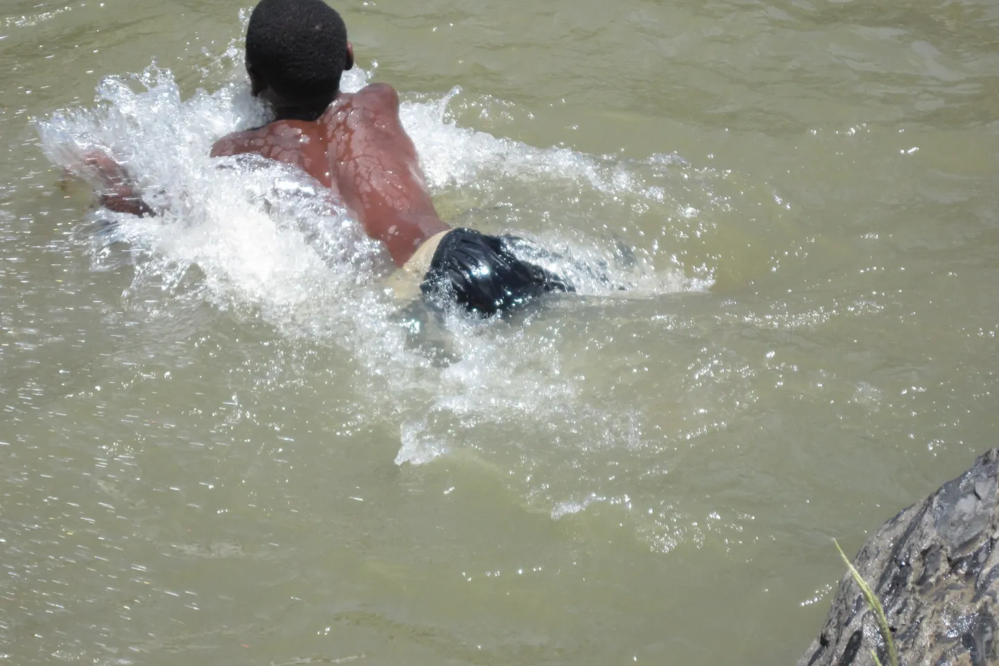 A boy swims in Umsizi River just outside of Estcourt, a town in KwaZulu-Natal Province.