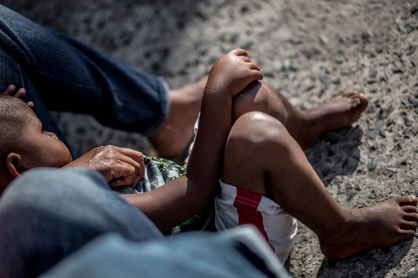 children-sitting-on-roadside