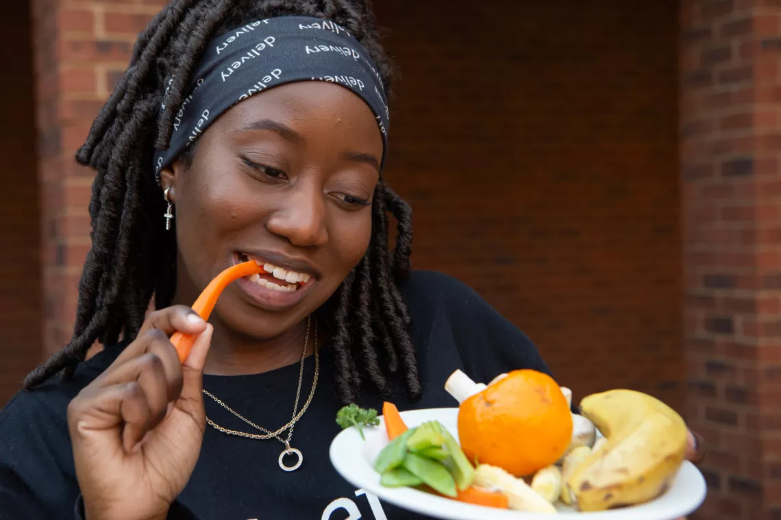Young-woman-eating-fruit-and-vegetables