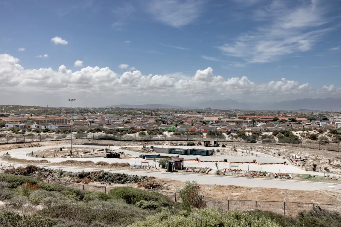 A waste collection plant with open veld in the background.