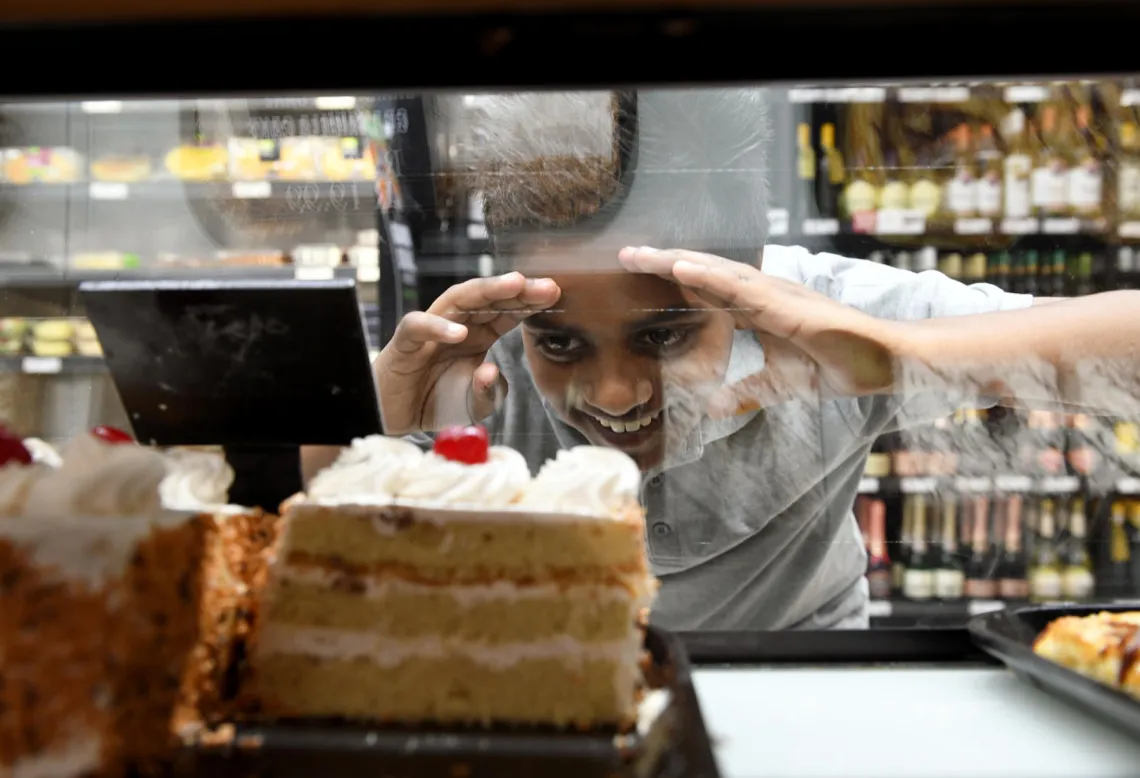 child-looking-at-slice-cake