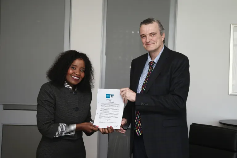 Dr Patience Nombeko Mbava, Chairperson of the Financial and Fiscal Commission and Mr Johannes Wedenig, UNICEF South Africa Representative with the signed Memorandum of Understanding between their two organisations