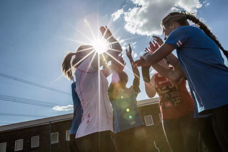 female-sport-team-high-five
