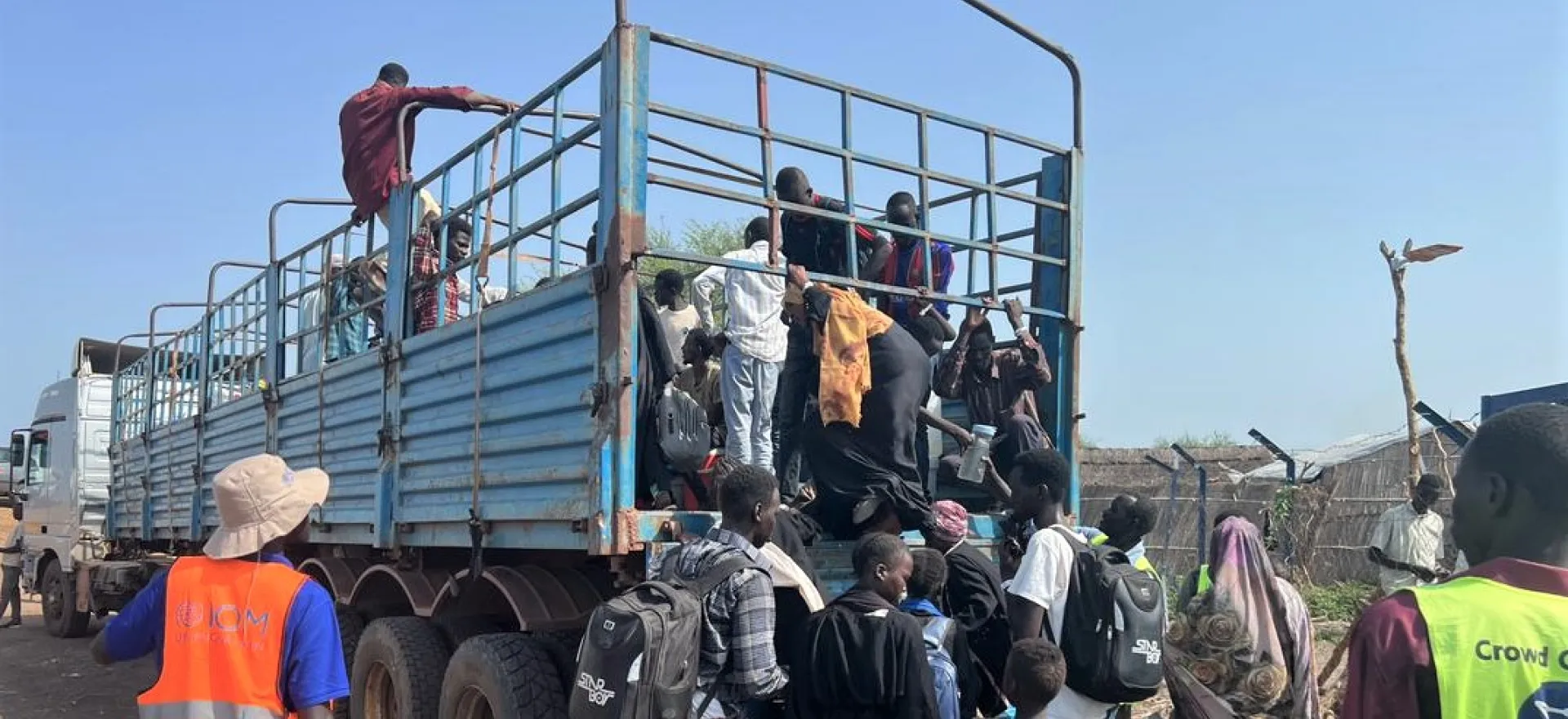 Truck transporting returnees from transit site to other areas where they can reunite with families, Renk, South Sudan.