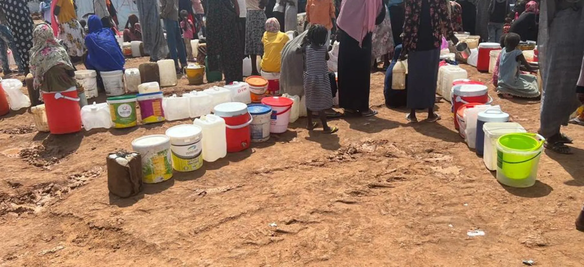 families queueing for water at water point in Renk, South Sudan