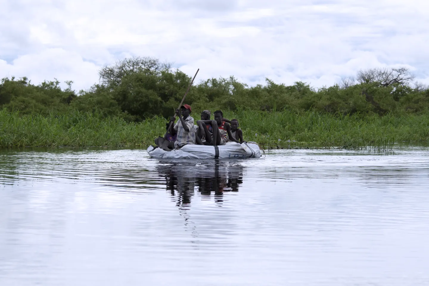 children on a makeshift raft