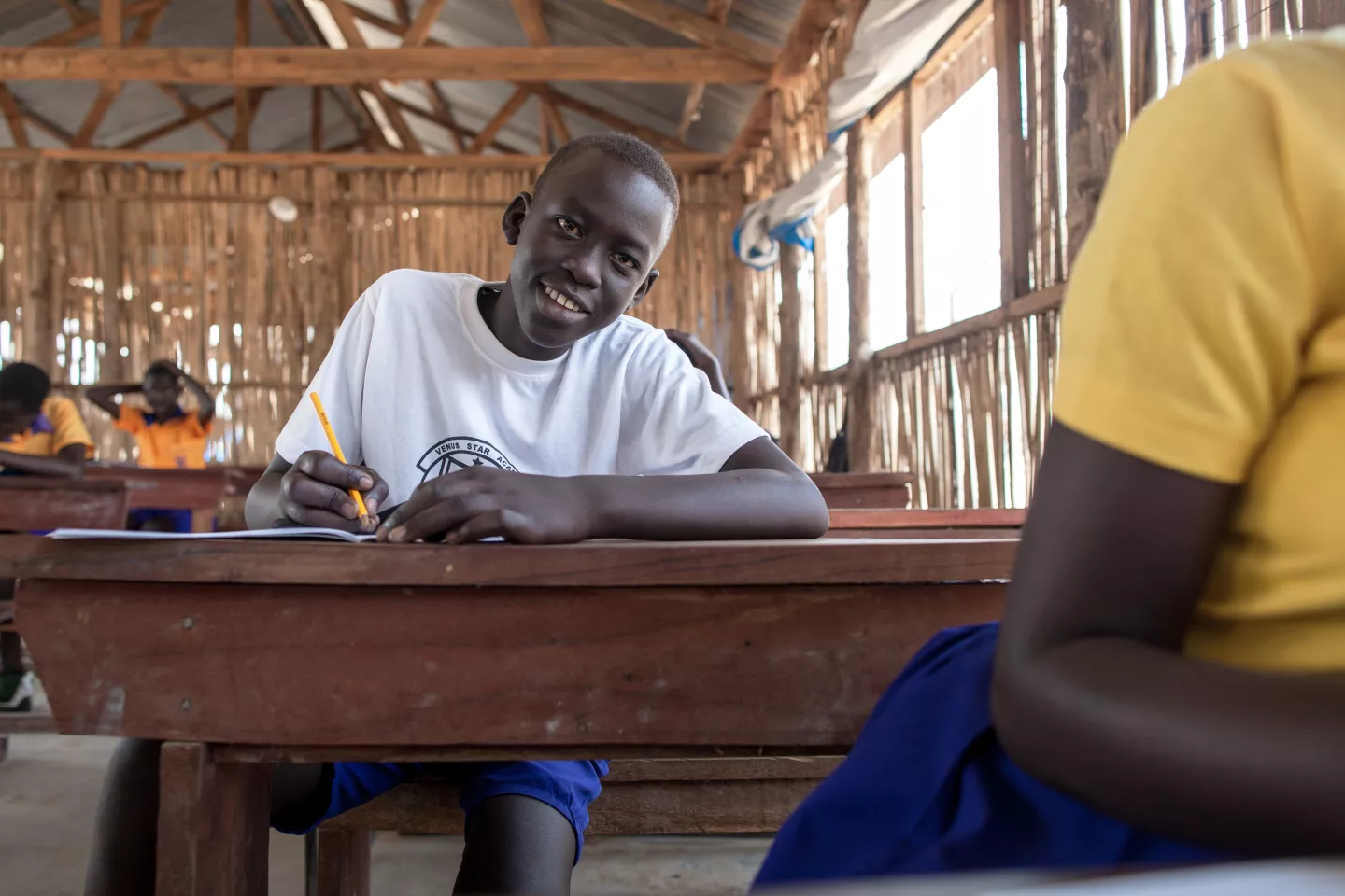 14-year-old Miakol Joseph writes a letter to his teacher to tell him how much he misses him