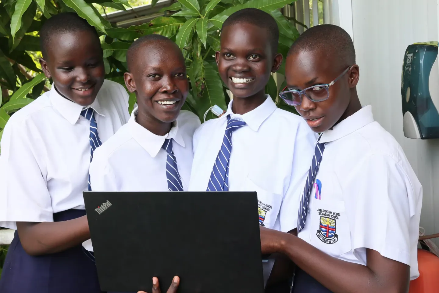 UNICEF young reporters in South Sudan are looking at a computer