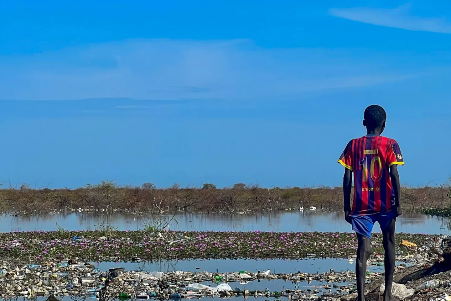 Young boy collect things from the dump to sell in order to get food