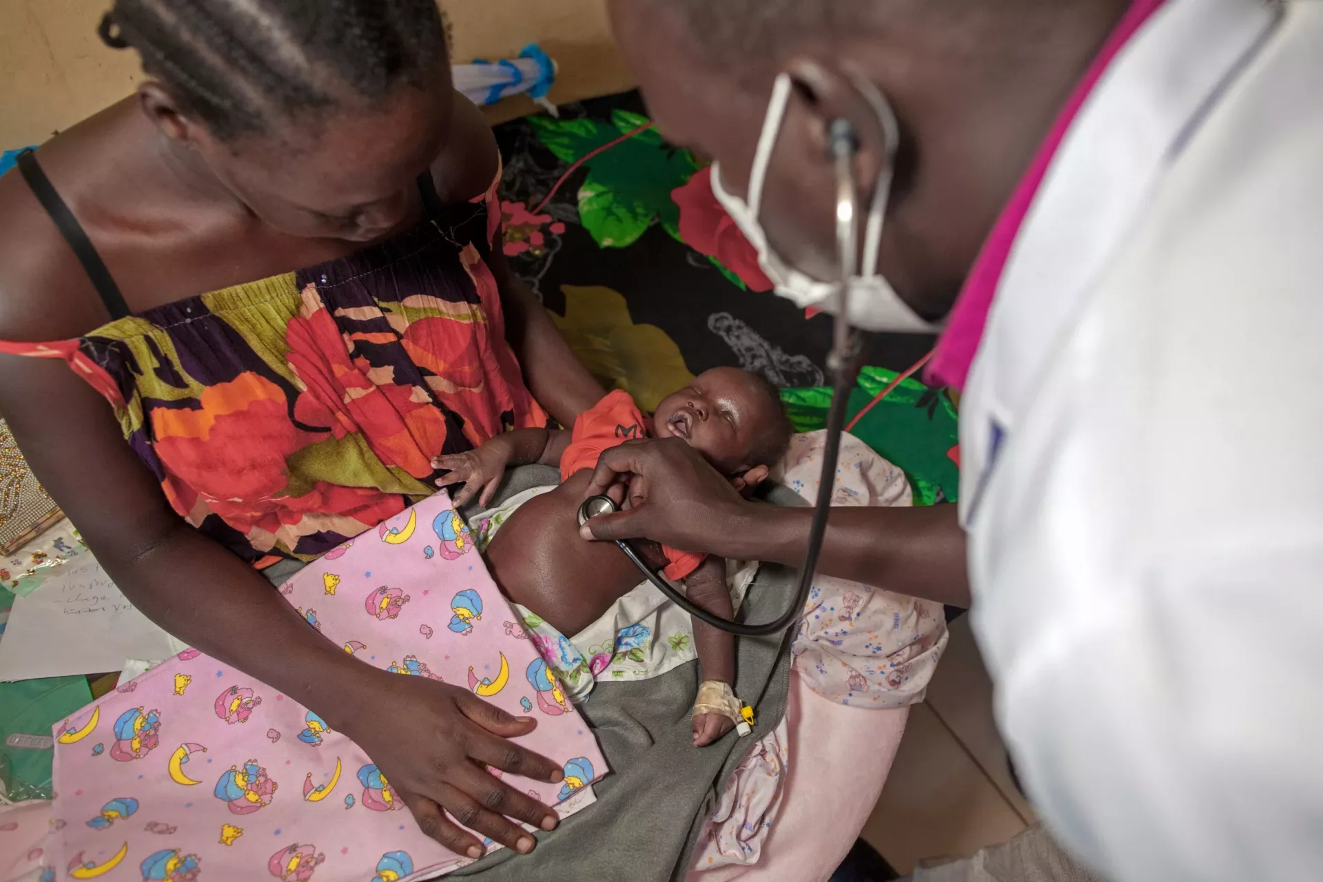 Dr Bol Chaw Manyang, Medical Director of the UNICEF/World Bank-supported Bor State Hospital, attends to 3 week old Ghai Mayen Ajak at the hospital in Bor in Jonglei State, South Sudan.  
