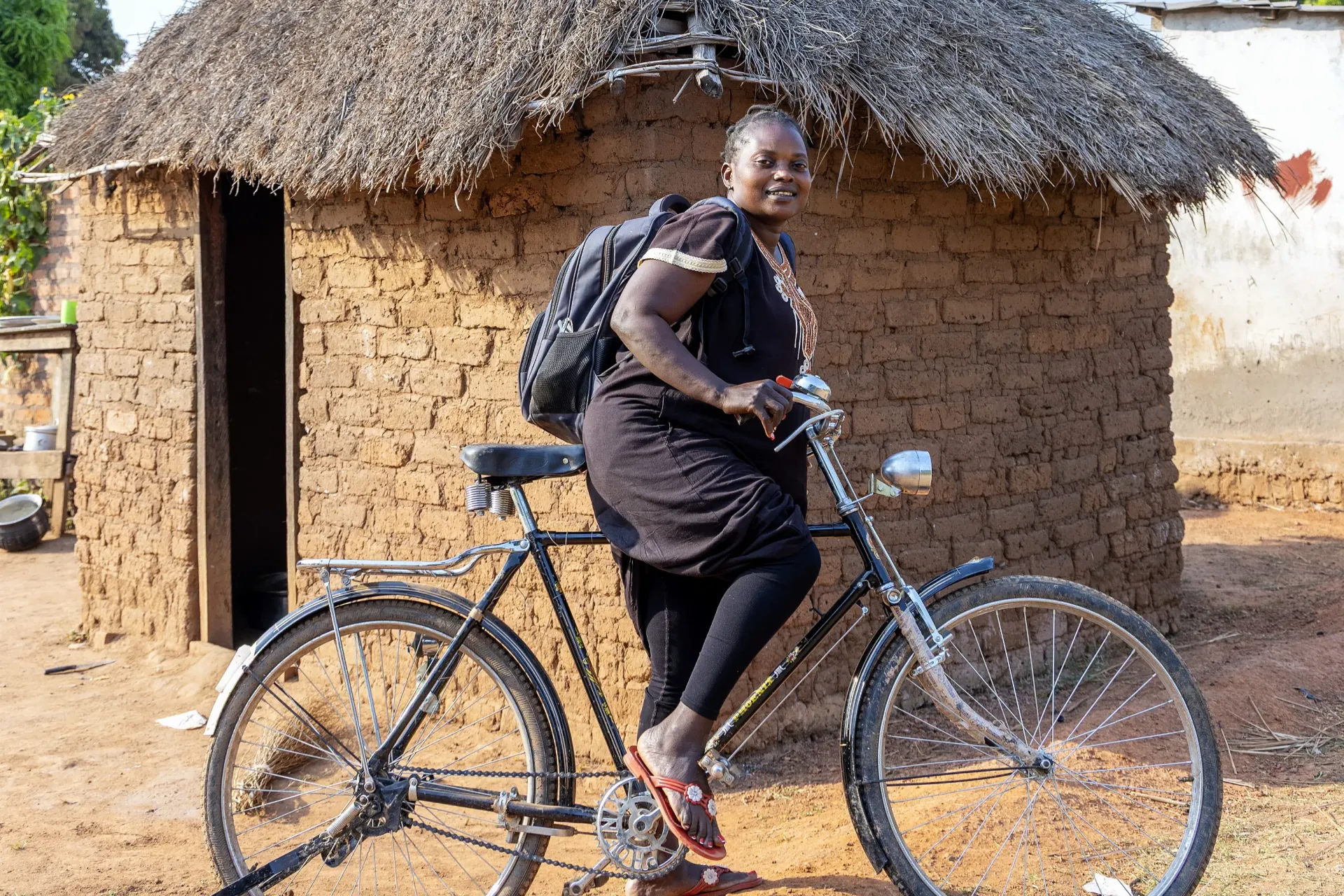 Alice is on her bicycle on her way to school in yambio, South Sudan