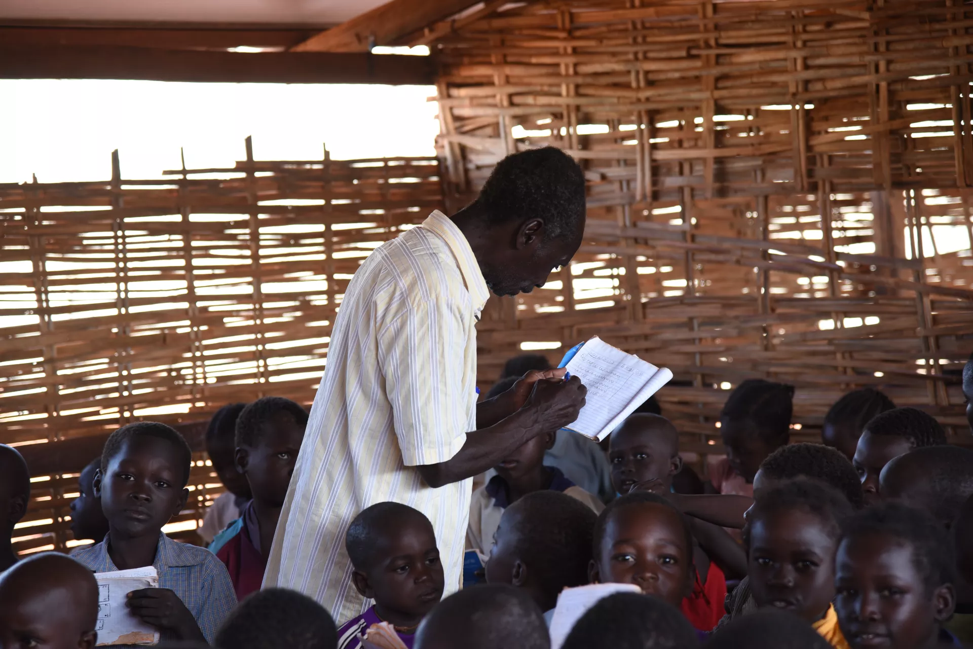 A teacher among students in a classroom