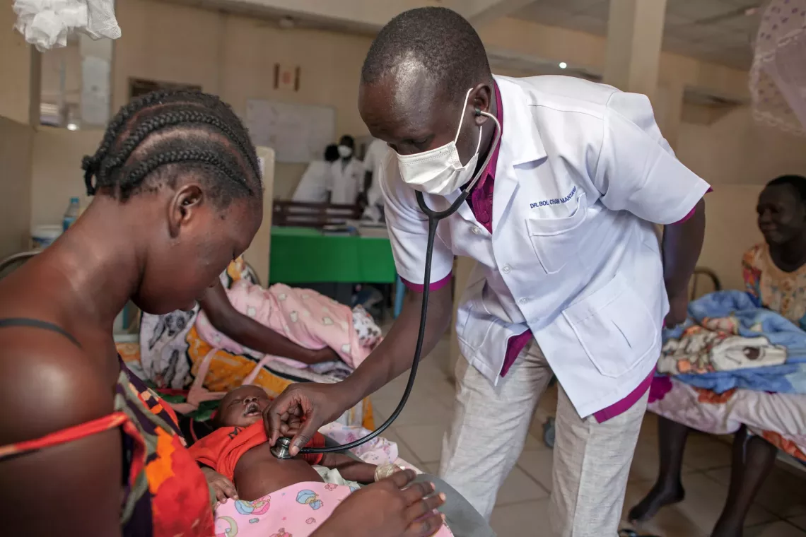 Doctor Chaw is checking the health status of a baby at Bor Hospital South Sudan
