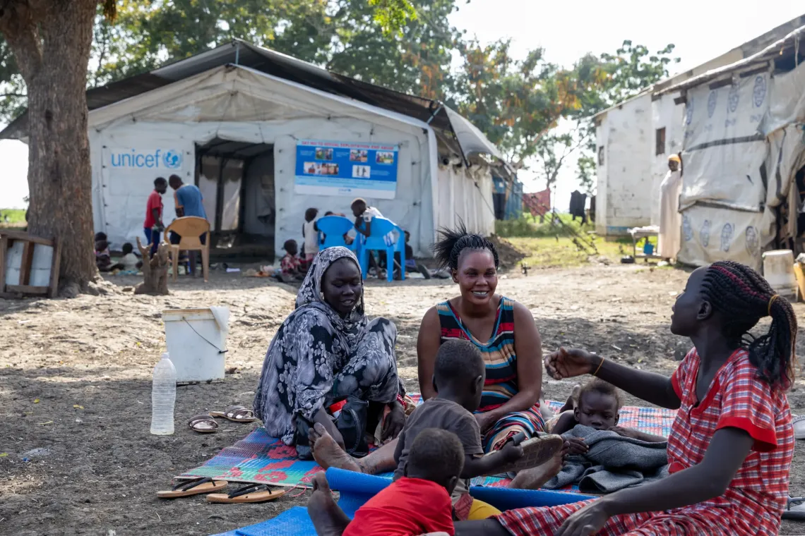 Family members returning from Sudan spend a calm evening together at Bulukat Transit Centre.