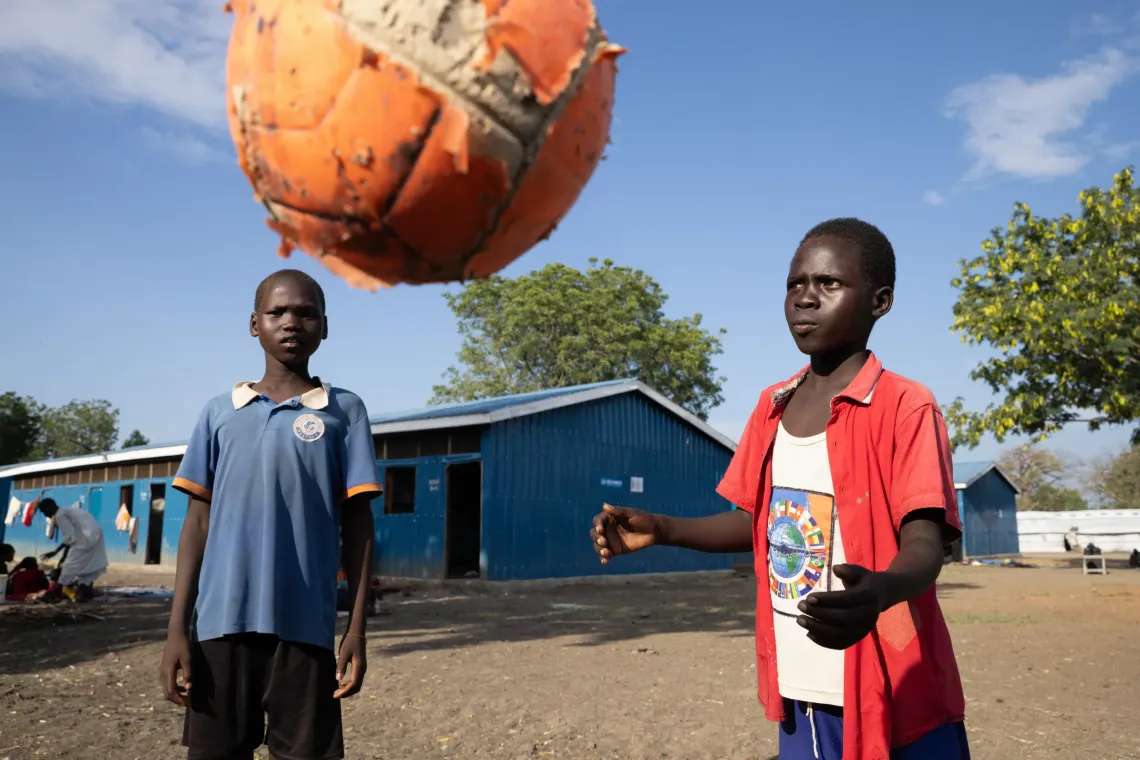 Two twelve year old friends , Jado Joseph (l) , who is a returnee and Aweng Wor, from the host community, play soccer at a UNICEF Child Friendly Space at the Bulkat transit center in Malakal, on October 27, 2025.