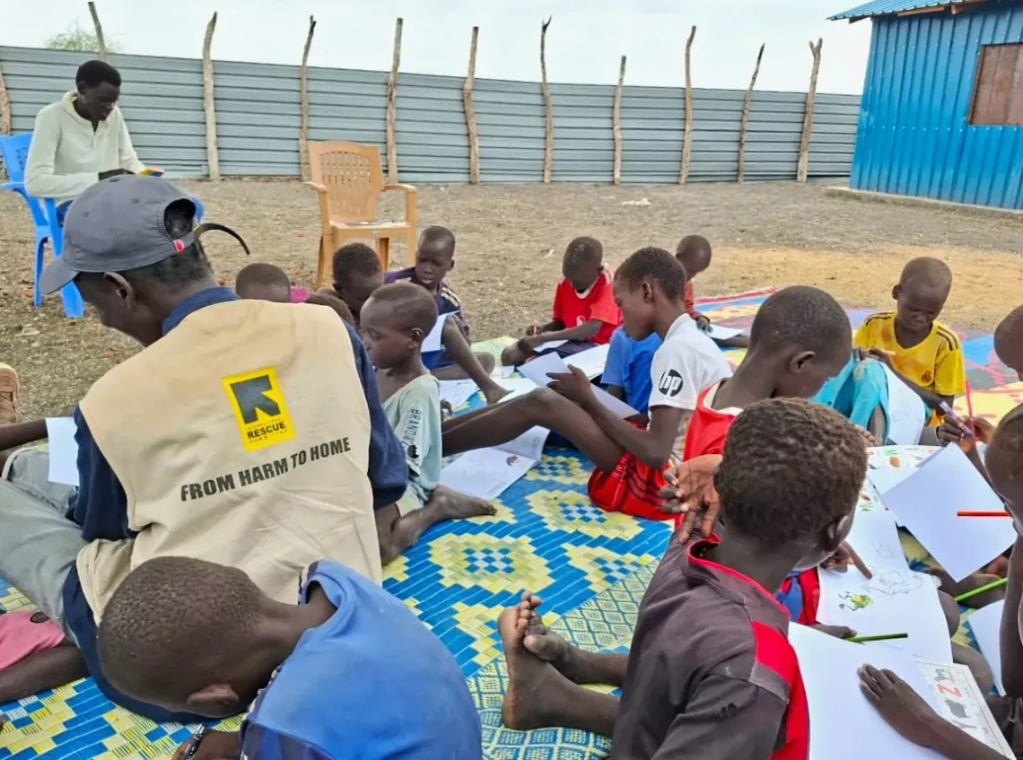 children are drawing in a child friendly space in Unity state South Sudan