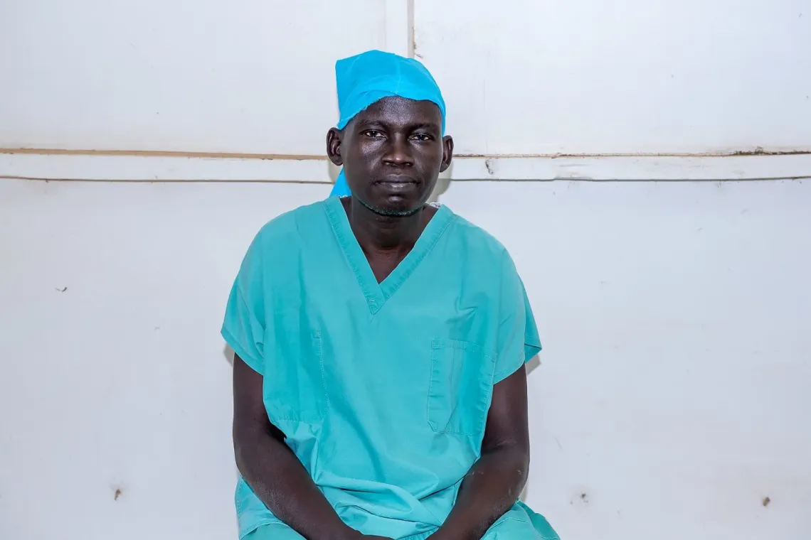 obstetrician and gynecologist Dr. David Tor is photographed sitting at a hospital in Bor, South Sudan