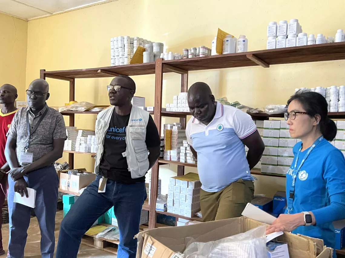 UNICEF team at Aweil Hospital looking at the health supplies