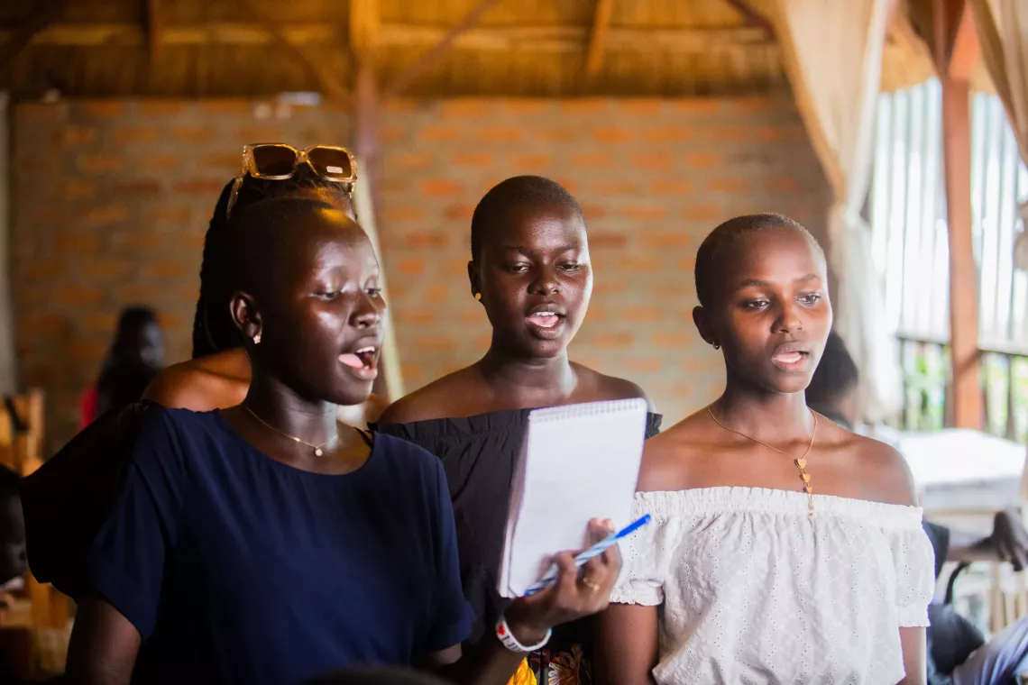 Young reporters are practicing a song they have written about their rights