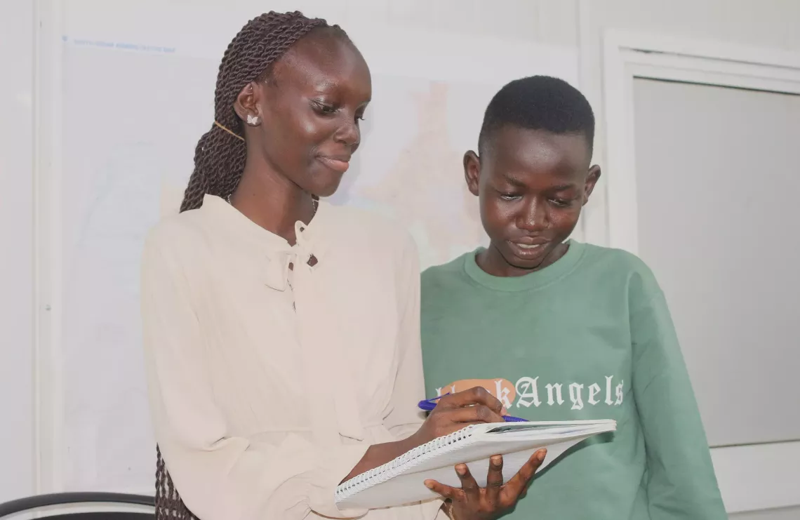 Esther a young reporter shares her ideas on education to her fellow young reporter in South Sudan