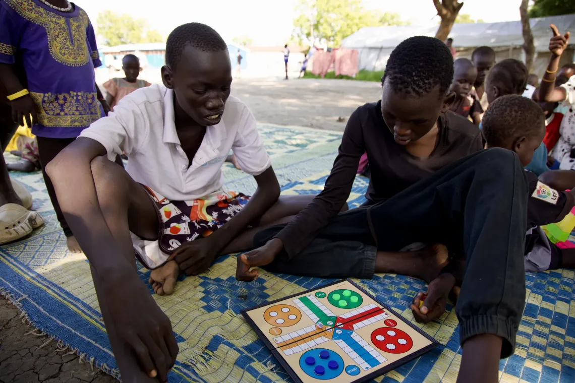 Jal and John playing a game at the Youth and Adolescent Centre in Malakal. 