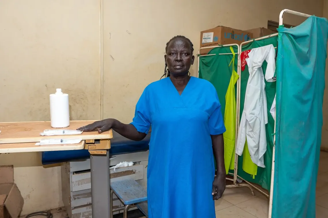 Mary a midwife is standing as she is being photographed in Bor Hospital South Sudan