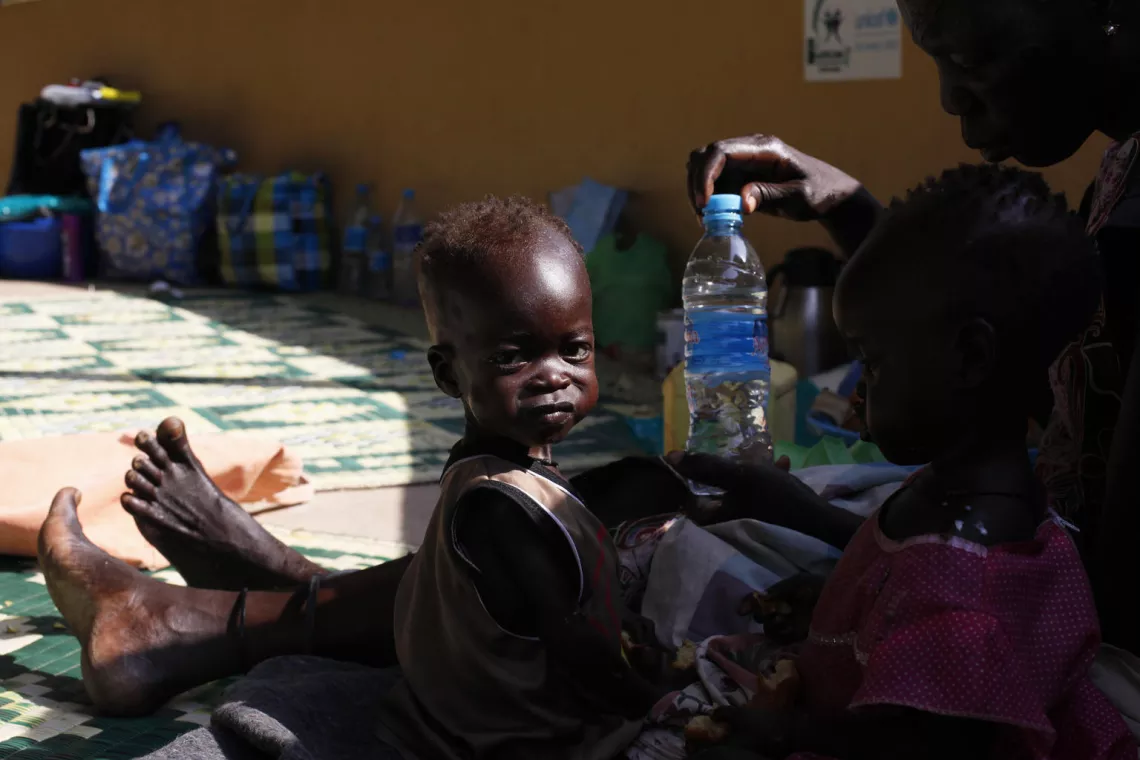 Kaku is feeding her twins Madelina and Elizabeth at Al Sabah Children's Hospital in Juba, South Sudan