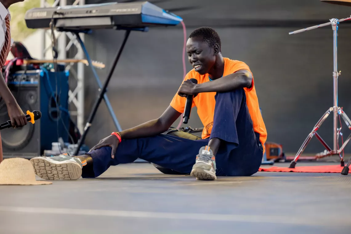 A young reporter is acting in a drama on World Children's Day celebration in Juba in 2024