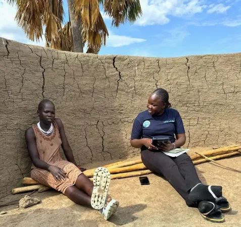 A mother receive and enumerator at her home for the MICS7 survey