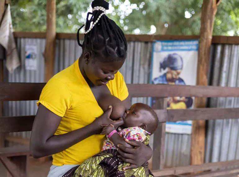 A mother is photographed as she breastfeeds her child in South Sudan.