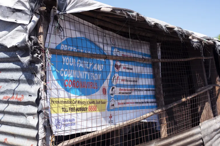 A poster in a shop in an IDP camp