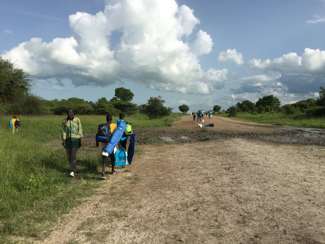 Children walking home after reintegration ceremony